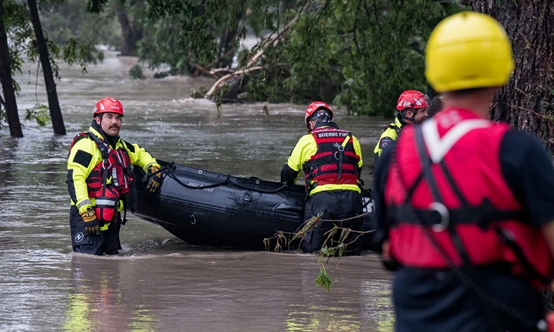 Boerne search and rescue team members prepare their Zodiac boat for operations on the flooded Guadalupe River on July 4, 2025 in Comfort, Texas. Heavy rainfall caused flooding along the Guadalupe River in central Texas with multiple fatalities reported. (Photo by Eric Vryn/Getty Images)