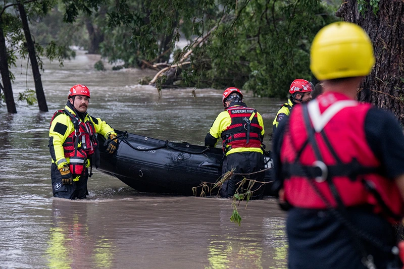 Boerne search and rescue team members prepare their Zodiac boat for operations on the flooded Guadalupe River on July 4, 2025 in Comfort, Texas. Heavy rainfall caused flooding along the Guadalupe River in central Texas with multiple fatalities reported. (Photo by Eric Vryn/Getty Images)