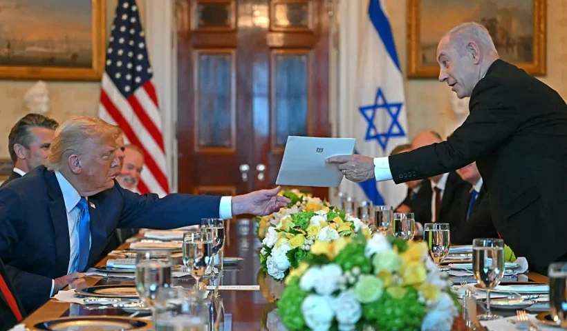 Israeli Prime Minister Benjamin Netanyahu (R) hands over a letter to US President Donald Trump as they meets at the Blue Room of the White House in Washington, DC, on July 7, 2025. Prime Minister Netanyahu will meet Monday with President Trump, who expressed hope for a "deal this week" between Israel and Hamas that sees hostages released from the Gaza Strip. Indirect negotiations between Israel and Hamas began on July 6 in Doha, aiming to broker a ceasefire and reach an agreement on the release of hostages in exchange for Palestinian prisoners. (Photo by ANDREW CABALLERO-REYNOLDS / AFP) (Photo by ANDREW CABALLERO-REYNOLDS/AFP via Getty Images)