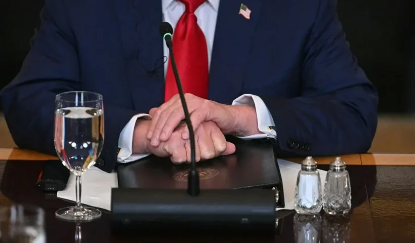 US President Donald Trump participates in a multilateral lunch with visiting African Leaders in the State Dining Room of the White House in Washington, DC, on July 9, 2025. Trump is hosting five leaders from West Africa Wednesday for a White House summit aimed at fostering trade to counter the growing regional influence of Russia and China. The White House is seeking to strengthen economic ties with the mineral-rich region as it curbs foreign aid to Africa, where countries have been hit by a 10 percent global import tariff announced by Trump. Talks with the presidents of Senegal, Liberia, Guinea-Bissau, Mauritania and Gabon are expected to focus on commercial opportunities and security. (Photo by Jim WATSON / AFP) (Photo by JIM WATSON/AFP via Getty Images)