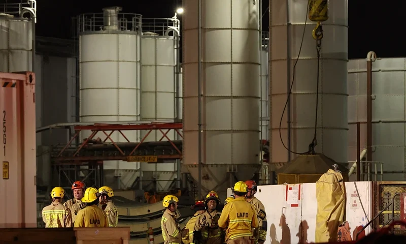 Los Angeles Fire Department (LAFD) firefighters are seen at the site of an industrial tunnel collapse in the Wilmington neighborhood of Los Angeles on July 9, 2025. 31 workers were safely removed from the tunnel without visible injuries, the LAFD said on July 9. (Photo by Patrick T. Fallon / AFP) (Photo by PATRICK T. FALLON/AFP via Getty Images)