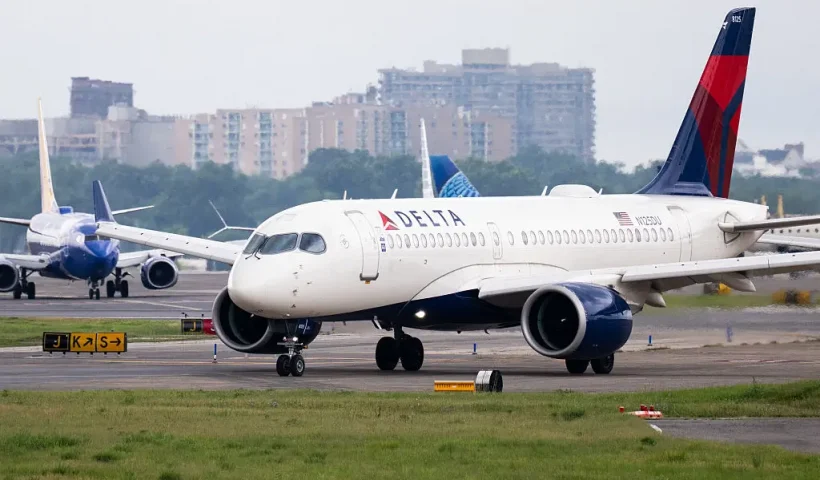 A Delta Air Lines Airbus A220 airplane prepares to takeoff at Ronald Reagan Washington National Airport in Arlington, Virginia, on July 10, 2025. Delta Air Lines stock shares surged more than 11 percent in early trading on Thursday, as the airline reported better-than-expected results. Between April and June, the group posted year-on-year sales of $16.65 billion and net income of $2.13 billion (+63% year-on-year). (Photo by SAUL LOEB / AFP) (Photo by SAUL LOEB/AFP via Getty Images)