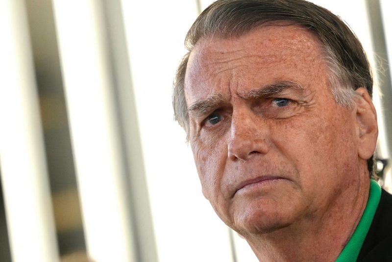 Former Brazilian President Jair Bolsonaro gestures as he speaks to the press at the Federal Senate in Brasilia on July 17, 2025. A prosecutor asked Brazil's Supreme Court on Tuesday to find Bolsonaro guilty of plotting a coup, in closing arguments after a trial that saw US President Donald Trump try to intervene on behalf of his right-wing ally. (Photo by Mateus Bonomi / AFP) (Photo by MATEUS BONOMI/AFP via Getty Images)