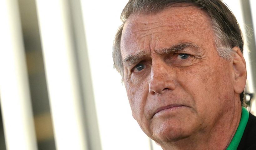 Former Brazilian President Jair Bolsonaro gestures as he speaks to the press at the Federal Senate in Brasilia on July 17, 2025. A prosecutor asked Brazil's Supreme Court on Tuesday to find Bolsonaro guilty of plotting a coup, in closing arguments after a trial that saw US President Donald Trump try to intervene on behalf of his right-wing ally. (Photo by Mateus Bonomi / AFP) (Photo by MATEUS BONOMI/AFP via Getty Images)