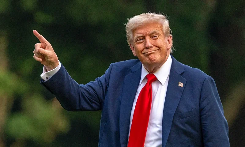 WASHINGTON, DC - JULY 13: U.S. President Donald Trump walks on the south lawn of the White House and points up at the new flag on July 13, 2025 in Washington, DC. President Trump and first lady Melania Trump spend the afternoon attending the final match of the FIFA Club World Cup at MetLife Stadium in East Rutherford, New Jersey. (Photo by Tasos Katopodis/Getty Images)