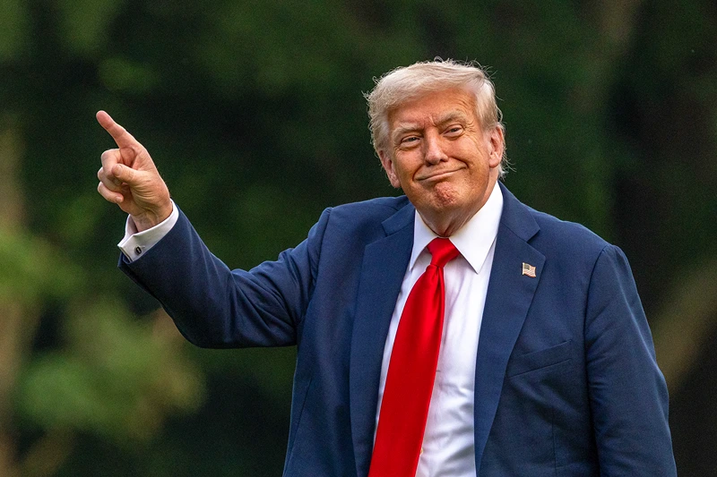 WASHINGTON, DC - JULY 13: U.S. President Donald Trump walks on the south lawn of the White House and points up at the new flag on July 13, 2025 in Washington, DC. President Trump and first lady Melania Trump spend the afternoon attending the final match of the FIFA Club World Cup at MetLife Stadium in East Rutherford, New Jersey. (Photo by Tasos Katopodis/Getty Images)