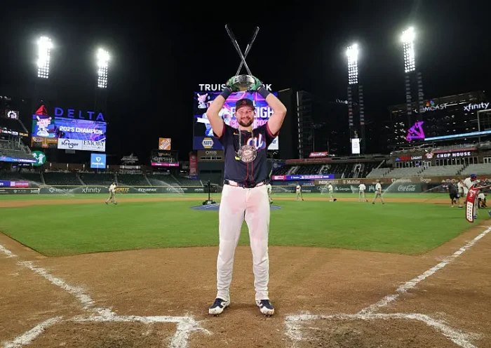 Cal Raleigh #29 of the Seattle Mariners poses with the trophy after winning the Home Run Derby at Truist Park on July 14, 2025 in Atlanta, Georgia. (Photo by Jamie Squire/Getty Images)