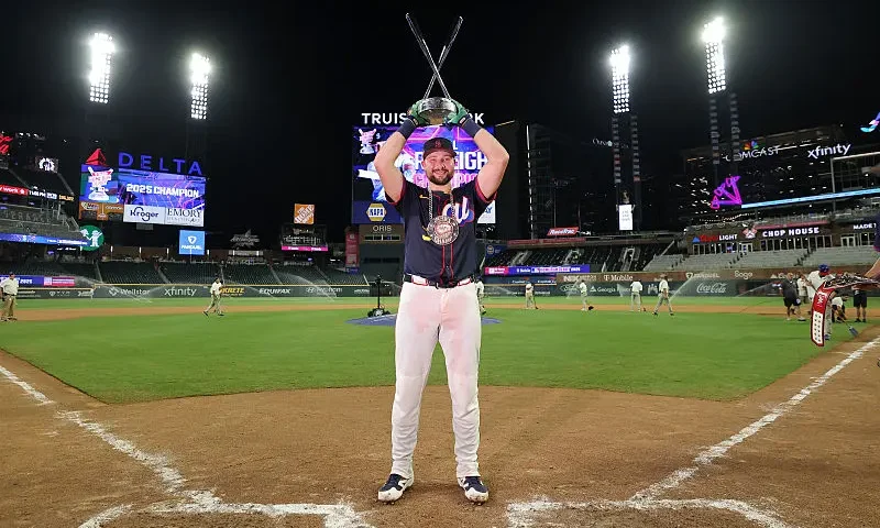 Cal Raleigh #29 of the Seattle Mariners poses with the trophy after winning the Home Run Derby at Truist Park on July 14, 2025 in Atlanta, Georgia. (Photo by Jamie Squire/Getty Images)