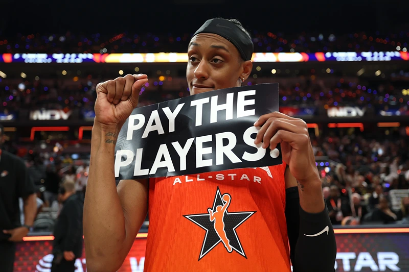 INDIANAPOLIS, INDIANA - JULY 19: Brittney Sykes #15 of the Washington Mystics holds a "Pay the Players" sign following the 2025 AT&T WNBA All-Star Game at Gainbridge Fieldhouse on July 19, 2025 in Indianapolis, Indiana. NOTE TO USER: User expressly acknowledges and agrees that, by downloading and or using this photograph, User is consenting to the terms and conditions of the Getty Images License Agreement. (Photo by Steph Chambers/Getty Images)