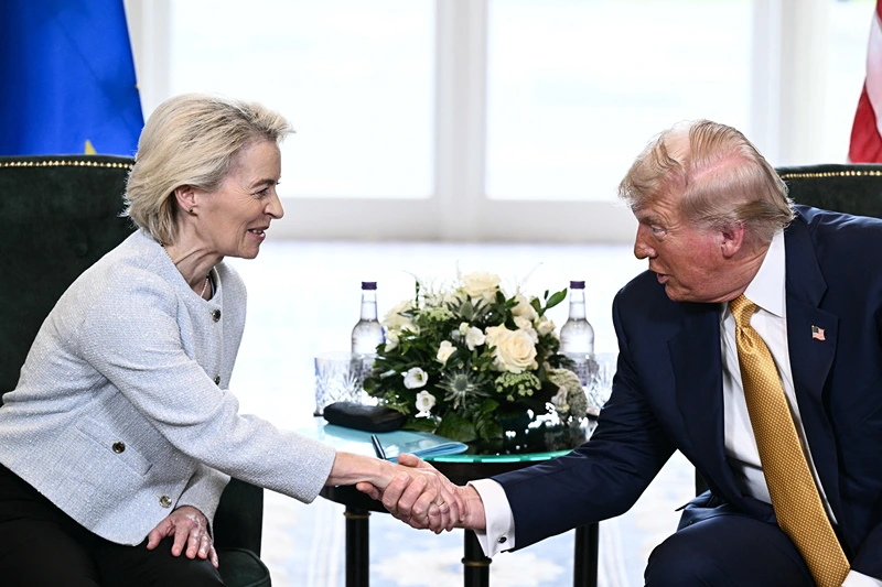 US President Donald Trump (R) shakes hands with European Commission President Ursula von der Leyen (L) during a meeting, in Turnberry south west Scotland, on July 27, 2025, on the third day of his visit to the country, since his second tenure as President began. Trump has said he sees a 50-50 chance of reaching a deal with the European Union, having vowed to hit dozens of countries with punitive tariffs unless they hammer out a pact with Washington by August 1, 2025. (Photo by Brendan SMIALOWSKI / AFP) (Photo by BRENDAN SMIALOWSKI/AFP via Getty Images)