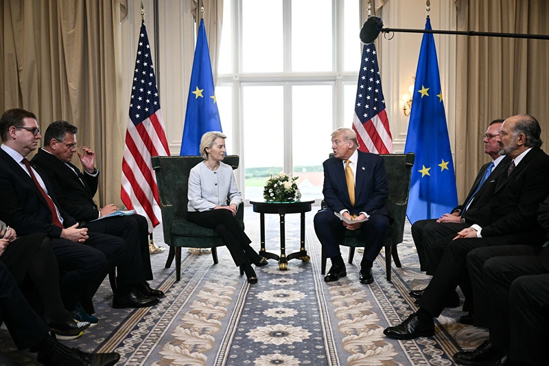 US President Donald Trump (R) and European Commission President Ursula von der Leyen (L) speak to the press after agreeing on a trade deal between the two economies following their meeting, in Turnberry south west Scotland on July 27, 2025, on the third day of his visit to the country, since his second tenure as President began. US President Donald Trump said on July 27, 2025 that he had reached a trade agreement with European Union chief Ursula von der Leyen. "We have reached a deal. It's a good deal for everybody," Trump told reporters after talks with von der Leyen at his golf resort in Turnberry, Scotland. The EU chief also hailed it as a "good deal". (Photo by Brendan SMIALOWSKI / AFP) (Photo by BRENDAN SMIALOWSKI/AFP via Getty Images)