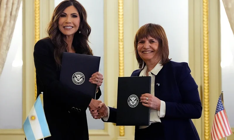 U.S. Homeland Security Secretary Kristi Noem (L) and Argentina's Minister of National Security Patricia Bullrich prepare to sign a bilateral agreement at the presidential palace on July 28, 2025 in Buenos Aires, Argentina. Noem is on a multi-day visit to Argentina, Chile, and Paraguay. (Photo by Alex Brandon-Pool/Getty Images)