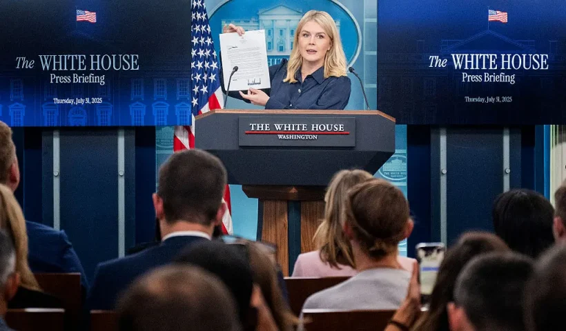 White House Press Secretary Karoline Leavitt displays a letter addressed to US pharmaceutical company Eli Lilly from President Donald Trump during a press briefing in the Brady Briefing Room of the White House in Washington, DC, on July 31, 2025. (Photo by Jim WATSON / AFP) (Photo by JIM WATSON/AFP via Getty Images)