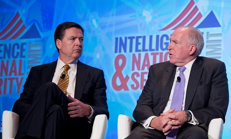 Federal Bureau of Investigation (FBI) Director James Comey (L) and Central Intelligence Agency (CIA) Director John Brennan speak at the 2016 Intelligence and National Security Summit in Washington, DC, September 8, 2016. / AFP / JIM WATSON (Photo credit should read JIM WATSON/AFP via Getty Images)
