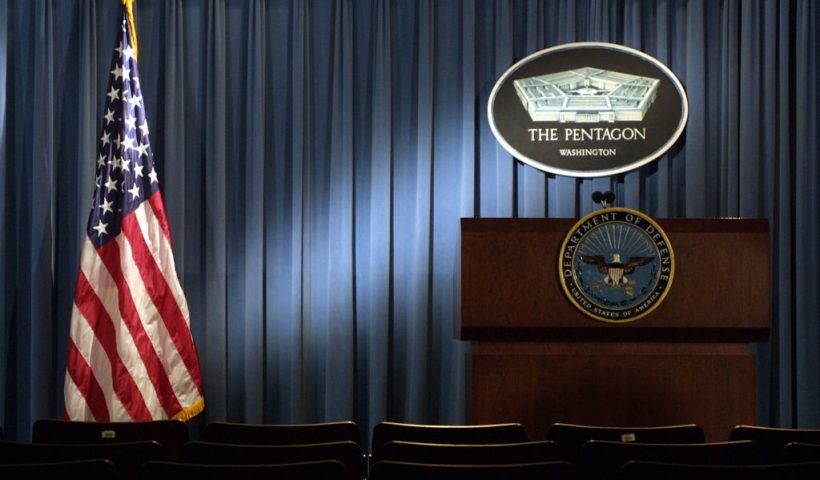 399192 06: The Pentagon logo and an American flag are lit up January 3, 2002 in the briefing room of Pentagon in Arlington, VA. (Photo by Alex Wong/Getty Images)