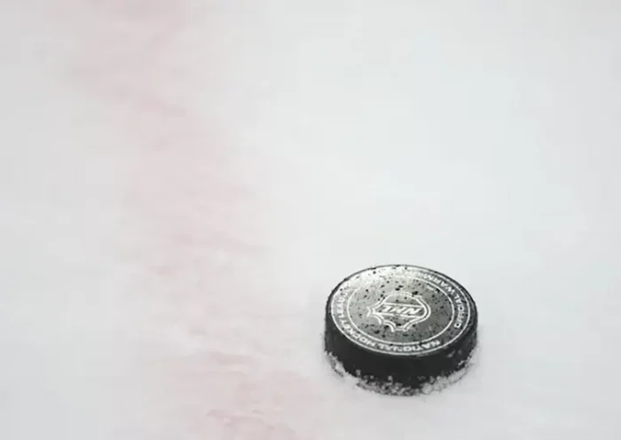 A National Hockey League puck is seen on the ice during warmups prior to a game between the Chicago Blackhawks and the Vegas Golden Knights at United Center. Mandatory Credit: Talia Sprague-Imagn Images/File Photo