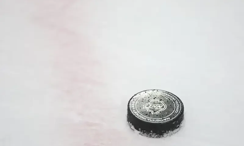 A National Hockey League puck is seen on the ice during warmups prior to a game between the Chicago Blackhawks and the Vegas Golden Knights at United Center. Mandatory Credit: Talia Sprague-Imagn Images/File Photo