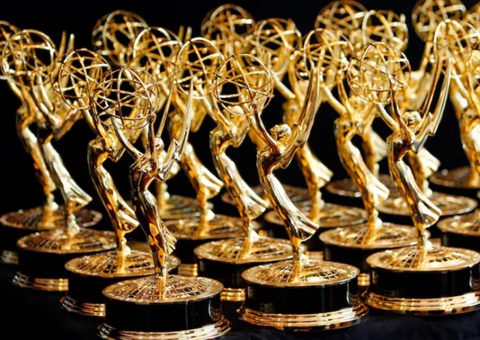 Dozens of Emmy Awards are lined up on the trophy table in the media center at the annual Primetime Emmy Awards in Los Angeles, California August 29, 2010. REUTERS/Danny Moloshok/File Photo