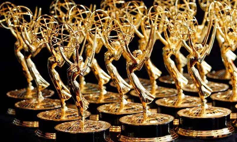 Dozens of Emmy Awards are lined up on the trophy table in the media center at the annual Primetime Emmy Awards in Los Angeles, California August 29, 2010. REUTERS/Danny Moloshok/File Photo