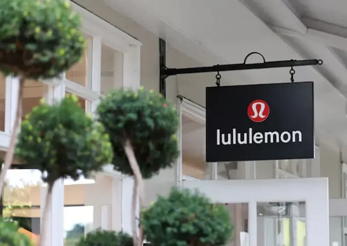 A logo is displayed above a Lululemon outlet retail store at Bicester Village in Oxfordshire, Britain, August 21, 2024. REUTERS/Hollie Adams/File Photo