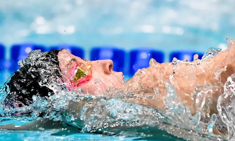 Regan Smith swims in the women’s 100 meter backstroke at the Toyota National Championships swimming meet at Indiana University Natatorium. Mandatory Credit: Robert Goddin-Imagn Images
