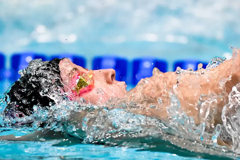 Regan Smith swims in the women’s 100 meter backstroke at the Toyota National Championships swimming meet at Indiana University Natatorium. Mandatory Credit: Robert Goddin-Imagn Images
