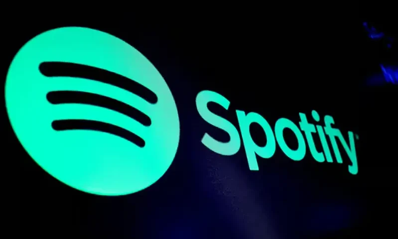 A screen displays the logo of Spotify on the floor at the New York Stock Exchange (NYSE) in New York City, U.S., December 4, 2023. REUTERS/Brendan McDermid/File Photo