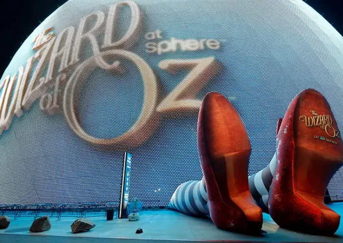 A display of 50-feet-long legs and 22-feet-tall ruby slippers, a promotion for the upcoming "Wizard of Oz at Sphere" movie, in Las Vegas, Nevada, U.S., August 20, 2025. REUTERS/Steve Marcus/File Photo