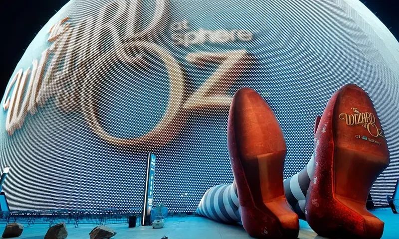 A display of 50-feet-long legs and 22-feet-tall ruby slippers, a promotion for the upcoming "Wizard of Oz at Sphere" movie, in Las Vegas, Nevada, U.S., August 20, 2025. REUTERS/Steve Marcus/File Photo