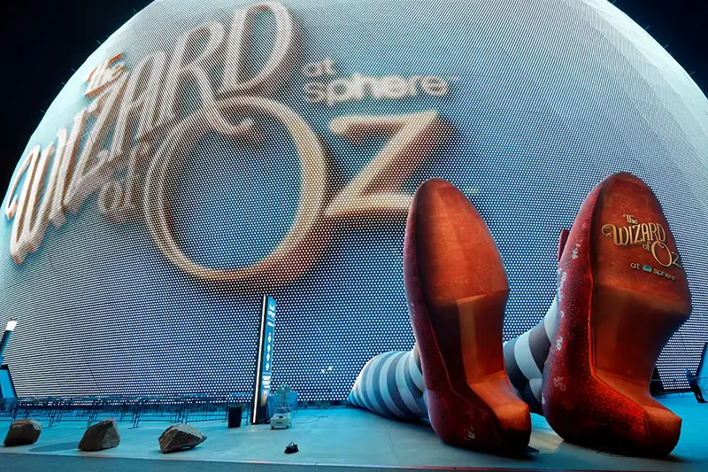 A display of 50-feet-long legs and 22-feet-tall ruby slippers, a promotion for the upcoming "Wizard of Oz at Sphere" movie, in Las Vegas, Nevada, U.S., August 20, 2025. REUTERS/Steve Marcus/File Photo