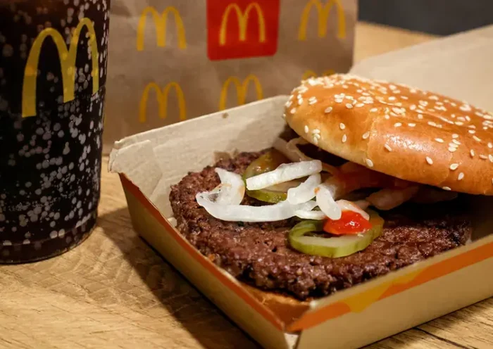 A McDonald's Quarter Pounder hamburger and coke, are seen in an illustration picture taken in New York City, U.S., October 24, 2024. REUTERS/Brendan McDermid/File photo
