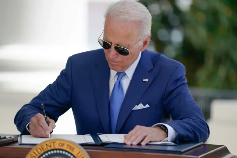 WASHINGTON, DC - AUGUST 05: U.S. President Joe Biden signs two bills aimed at combating fraud in the COVID-19 small business relief programs at the White House on August 5, 2022 in Washington, DC. Biden signed into law two bipartisan measures to take action against those who commit fraud in abuse of COVID-19 small-business relief programs. (Photo by Evan Vucci - Pool/Getty Images)