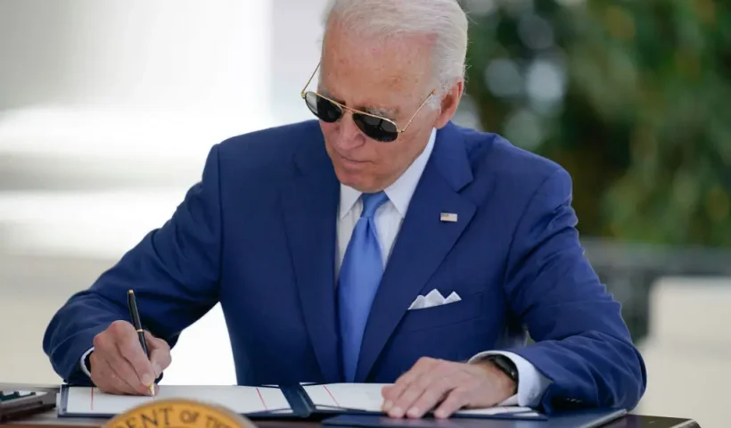 WASHINGTON, DC - AUGUST 05: U.S. President Joe Biden signs two bills aimed at combating fraud in the COVID-19 small business relief programs at the White House on August 5, 2022 in Washington, DC. Biden signed into law two bipartisan measures to take action against those who commit fraud in abuse of COVID-19 small-business relief programs. (Photo by Evan Vucci - Pool/Getty Images)