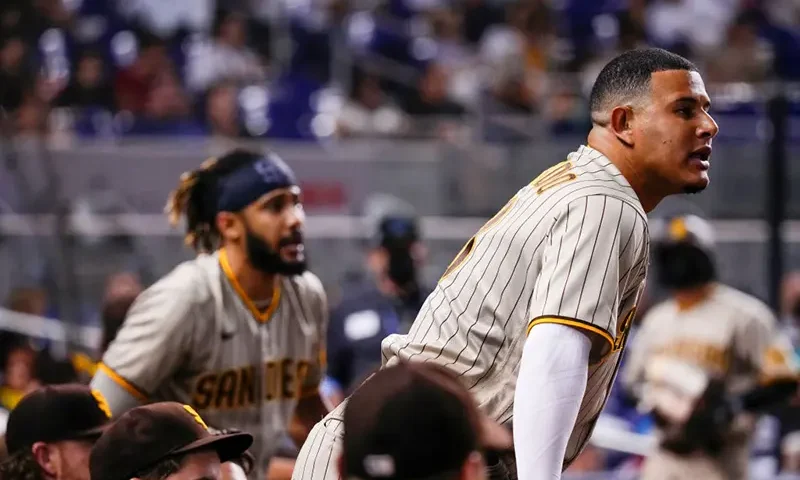 Manny Machado #13 and Fernando Tatis Jr. #23 of the San Diego Padres at loanDepot park on July 24, 2021 in Miami, Florida. (Photo by Mark Brown/Getty Images)
