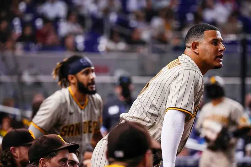 Manny Machado #13 and Fernando Tatis Jr. #23 of the San Diego Padres at loanDepot park on July 24, 2021 in Miami, Florida. (Photo by Mark Brown/Getty Images)