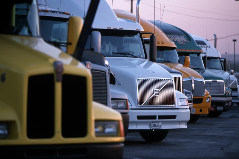 370225 03: Tractor-trailer rigs are parked at the Petro truck stop May 29, 2000in El Paso, TX. Many of the rigs now have modern wireless communications as well as cable television, refrigerators, double bunk beds, and microwave ovens. In the last few years trucks have become more like a home/office on the road. (Photo by Joe Raedle/Newsmakers)