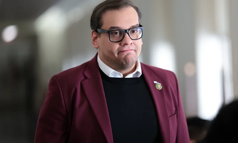 WASHINGTON, DC - OCTOBER 13: U.S. Rep. George Santos (R-NY) returns to a House Republican caucus meeting at the Longworth House Office Building on October 13, 2023 in Washington, DC. House Republicans continue to debate their pick for Speaker after their initial nominee, Rep. Steve Scalise (R-LA), withdrew his name from the race after failing to secure the number of votes needed. The full House of Representatives is expected to vote on a replacement for former Speaker Kevin McCarthy (R-CA) after he was ousted last week. (Photo by Win McNamee/Getty Images)