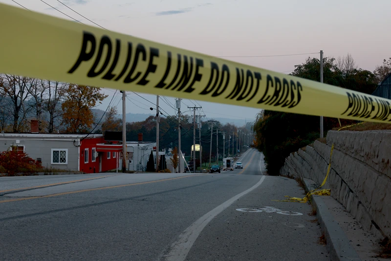 LEWISTON, MAINE - OCTOBER 27: Law Enforcement officials continue their investigation at the Schemengees Bar where one of two mass shootings took place on October 27, 2023 in Lewiston, Maine. Police are still searching for the suspect, Robert Card, who allegedly killed 18 people in two separate locations on Wednesday night. (Photo by Joe Raedle/Getty Images)