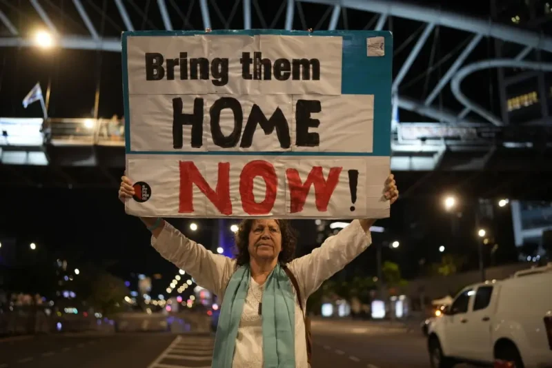 TEL AVIV, ISRAEL - NOVEMBER 21: People demonstrate prior any hostage announcements outside the Kirya defense complex as the political cabinet hold a meeting on November 21, 2023 in Tel Aviv, Israel. Families and supporters of hostages held by Hamas in Gaza gathered near The Kirya defense complex this evening as the Israeli cabinet convened regarding a proposed deal with Hamas for the release of some hostages. The full terms of such a deal were not clear, but both the Israeli prime minister and Hamas leader reported progress. (Photo by Christopher Furlong/Getty Images)