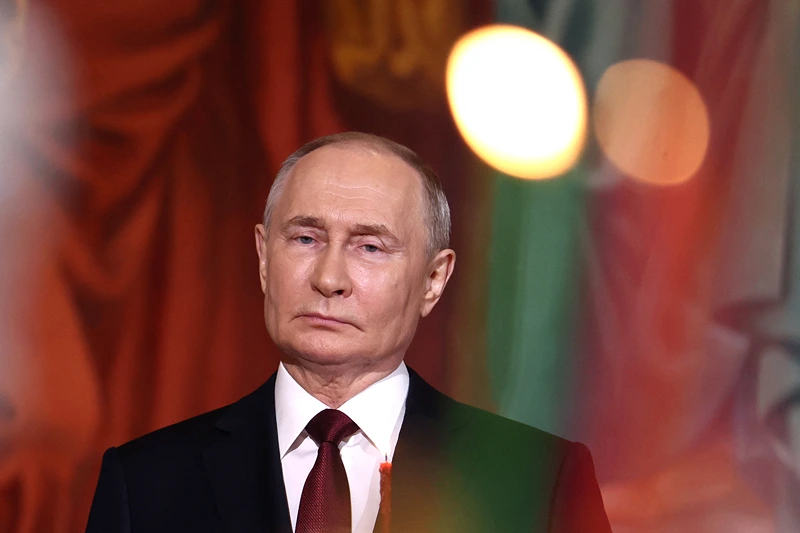 TOPSHOT - In this pool photograph distributed by Russian state agency Sputnik, Russia's President Vladimir Putin attends an Orthodox Easter service at the Christ the Saviour Cathedral in Moscow early on May 5, 2024. (Photo by Valery SHARIFULIN / POOL / AFP) (Photo by VALERY SHARIFULIN/POOL/AFP via Getty Images)