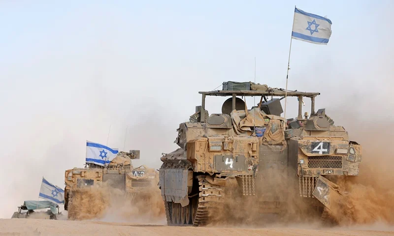 TOPSHOT - Israeli army battle tanks operate in southern Israel near the border with the Gaza Strip on May 29, 2024, amid the ongoing conflict in the Palestinian territory between Israel and the Hamas movement. (Photo by JACK GUEZ / AFP) (Photo by JACK GUEZ/AFP via Getty Images)