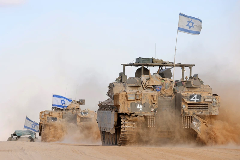 TOPSHOT - Israeli army battle tanks operate in southern Israel near the border with the Gaza Strip on May 29, 2024, amid the ongoing conflict in the Palestinian territory between Israel and the Hamas movement. (Photo by JACK GUEZ / AFP) (Photo by JACK GUEZ/AFP via Getty Images)