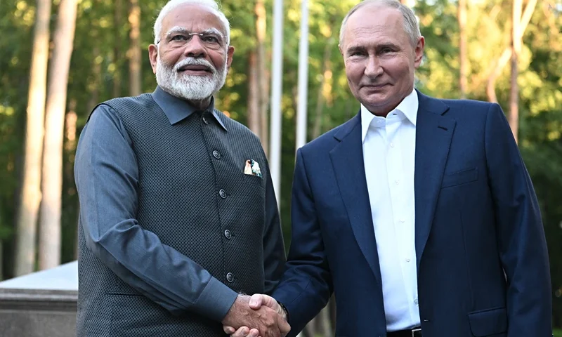 In this pool photograph distributed by the Russian state agency Sputnik, Russia's President Vladimir Putin welcomes Indian Prime Minister Narendra Modi for an informal meeting at the Novo-Ogaryovo state residence, outside Moscow, on July 8, 2024. (Photo by Sergei BOBYLYOV / POOL / AFP) (Photo by SERGEI BOBYLYOV/POOL/AFP via Getty Images)