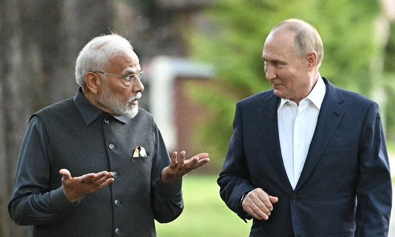 TOPSHOT - In this pool photograph distributed by the Russian state agency Sputnik, Russia's President Vladimir Putin and Indian Prime Minister Narendra Modi take a walk during an informal meeting at the Novo-Ogaryovo state residence, outside Moscow, on July 8, 2024. (Photo by Sergei BOBYLYOV / POOL / AFP) (Photo by SERGEI BOBYLYOV/POOL/AFP via Getty Images)