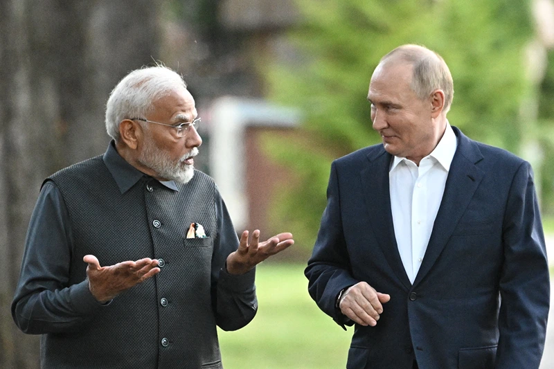TOPSHOT - In this pool photograph distributed by the Russian state agency Sputnik, Russia's President Vladimir Putin and Indian Prime Minister Narendra Modi take a walk during an informal meeting at the Novo-Ogaryovo state residence, outside Moscow, on July 8, 2024. (Photo by Sergei BOBYLYOV / POOL / AFP) (Photo by SERGEI BOBYLYOV/POOL/AFP via Getty Images)
