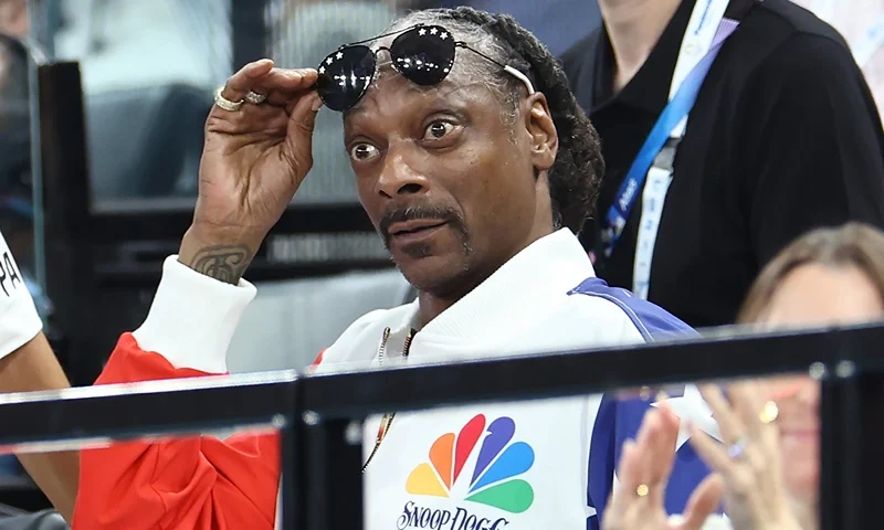 PARIS, FRANCE - JULY 28: Snoop Dogg (R) attends the Artistic Gymnastics Women's Qualification on day two of the Olympic Games Paris 2024 at Bercy Arena on July 28, 2024 in Paris, France. (Photo by Arturo Holmes/Getty Images)