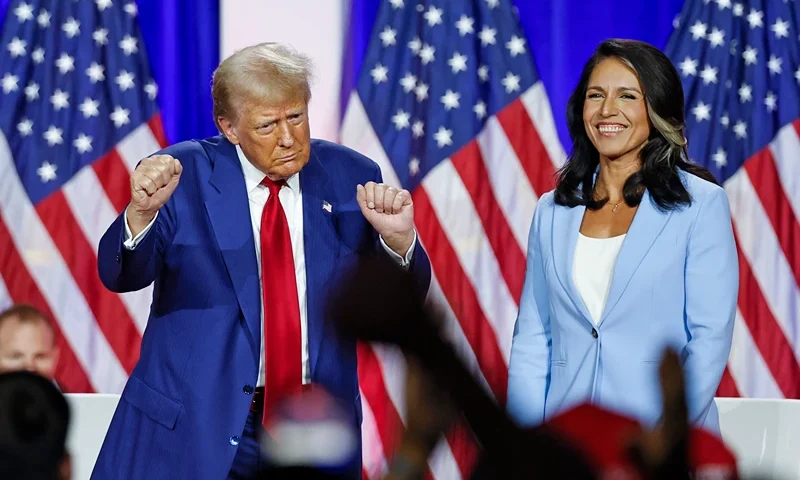 TOPSHOT - Former US President and Republican presidential candidate Donald Trump (L) dances as he leaves the stage after speaking alongside former US Representative Tulsi Gabbard during a town hall meeting in La Crosse, Wisconsin, on August 29, 2024. (Photo by KAMIL KRZACZYNSKI / AFP) (Photo by KAMIL KRZACZYNSKI/AFP via Getty Images)