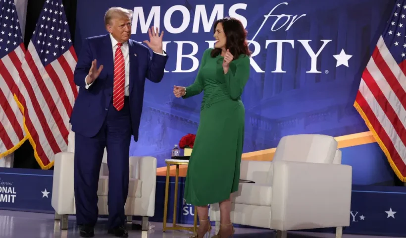 WASHINGTON, DC - AUGUST 30: Republican presidential nominee, former U.S. President Donald Trump (L) and Co-founder of Moms for Liberty Tiffany Justice (R) dance on the stage during the 2024 Joyful Warriors National Summit on August 30, 2024 in Washington, DC. Trump continued to campaign for the upcoming presidential election on November 5, 2024. (Photo by Alex Wong/Getty Images)