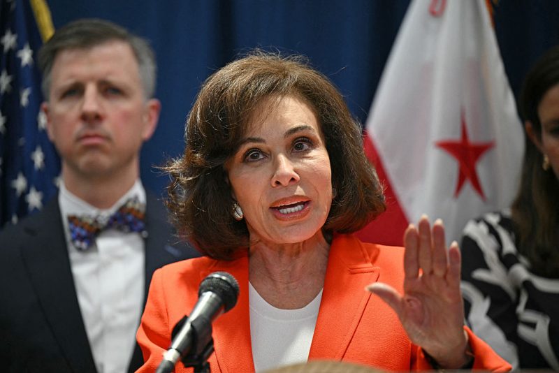 Interim US Attorney Jeanine Pirro (C) speaks during a press update on a shooting the night before, of two Israeli embassy staffers, at the US Department of Justice in Washington, DC, on May 22, 2025. Two Israeli embassy staffers, identified as Yaron Lischinsky and Sarah Lynn Milgrim by the Israeli foreign ministry, were shot dead late May 21, outside a Jewish museum in Washington by a gunman who shouted "free Palestine," authorities said, with US officials and Israeli diplomats expressing shock and outrage over the killings. (Photo by Drew ANGERER / AFP) (Photo by DREW ANGERER/AFP via Getty Images)