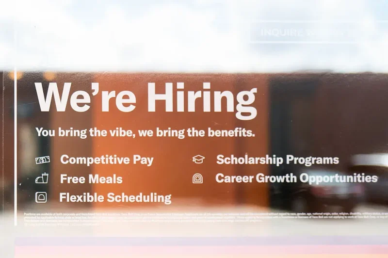 AUSTIN, TEXAS - JUNE 25: A hiring sign is displayed in a Taco Bell window on June 25, 2025 in Austin, Texas. The Texas labor market has set a new record high job count for its sixth consecutive month in a row by adding 28,100 positions over the month of May to reach a total of 14,340,800 non-farm jobs according to the Texas Workforce Commission. (Photo by Brandon Bell/Getty Images)